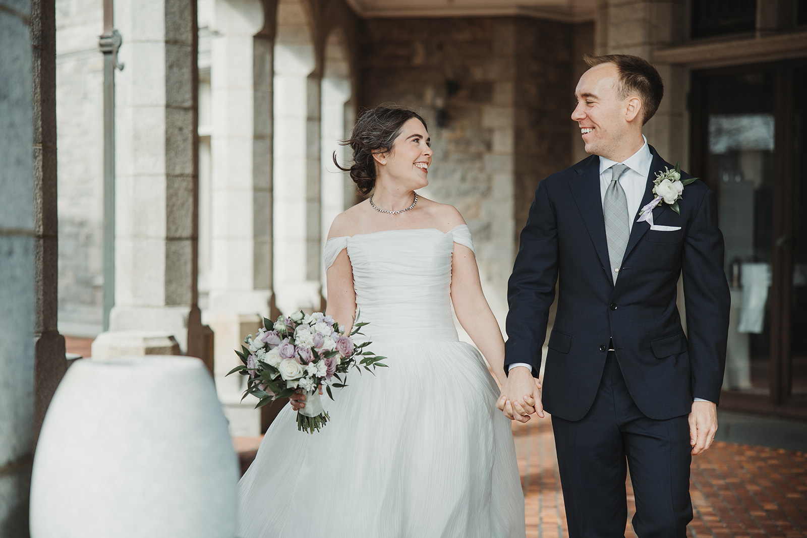 Bride and Groom Holding Hands Walking to Wedding Reception